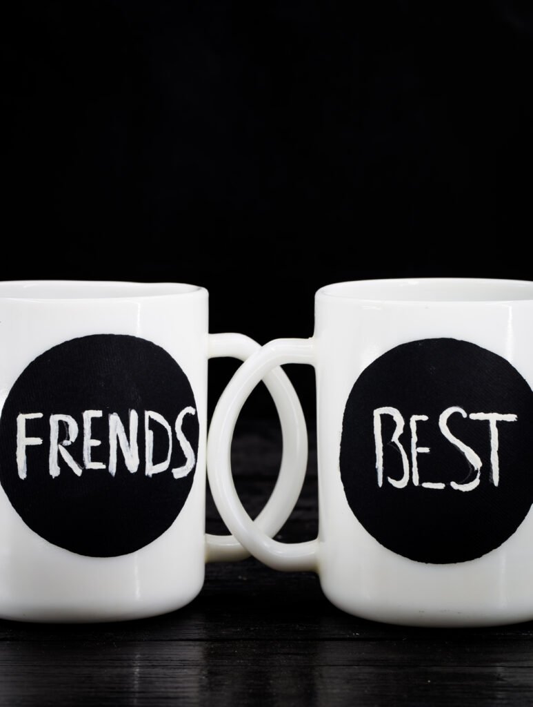 two white cups with the inscription